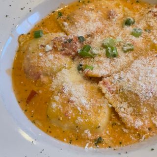 Giuseppe's Ristorante Italiano signature dishes Lobster Ravioli, Frutti di Mare, Arancini, Tiramisu.